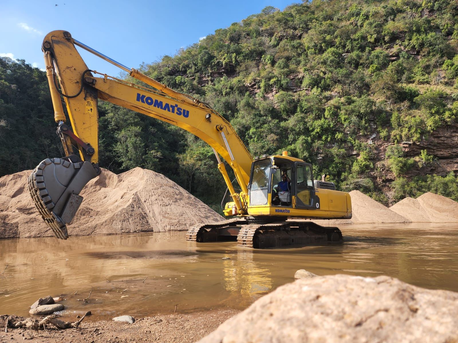 Komatsu excavator at a river site